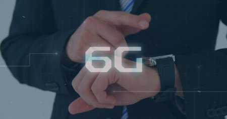 Man in suit checking watch, 6G graphic overlaying. He standing, wearing dark suit, white shirt, tieの写真素材