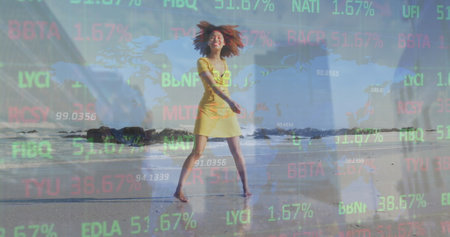 Image of world map and financial data processing over african american woman on beach. Global business, finance, computing and data processing concept digitally generated image.の写真素材