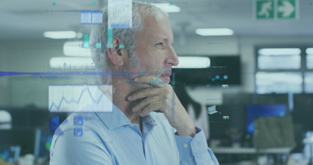 Image of financial data processing over caucasian businessman in office. Global business, finances, computing and data processing concept digitally generated image.の写真素材