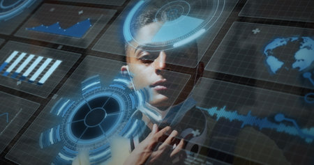 Image of scope scanning and data processing over biracial man wearing face mask. Global business, data processing and digital interface concept digitally generated image.の写真素材