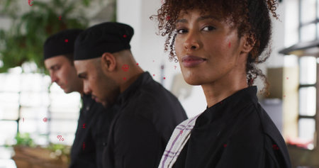 Image of red currency and shapes over happy african american chef. Restaurants, business and economy concept digitally generated image.の写真素材