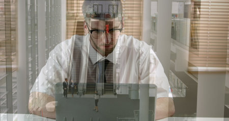 Image of walking people over caucasian businessmen using laptop. Global business and data processing concept digital generated image.の写真素材