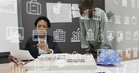 Image of business icons over diverse business people discussing work in office. Business, technology...
