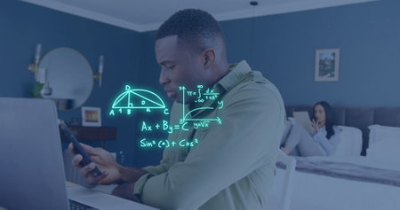 Image of equations over african american man using laptop and smartphone in bedroom. Learning,...