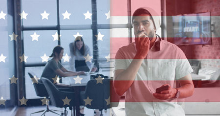 Image of flag of usa over diverse business people in office. American finance, business, connections and diversity concept digitally generated image.の写真素材