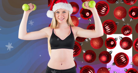 Image of caucasian sportswoman and baubles over snow falling. Christmas, celebration and digital interface concept digitally generated image.の写真素材