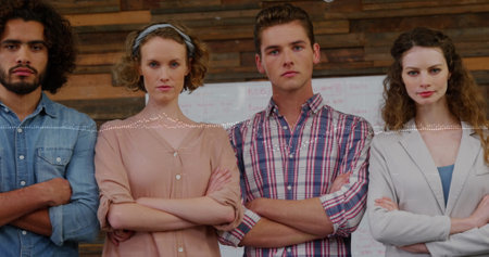 Image of financial data processing over diverse business people at office. Global finances, business and digital interface concept digitally generated image.の写真素材