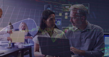 Image of stock market data processing over diverse man and woman discussing at office. Global...