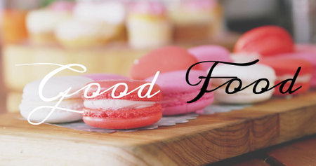 Colorful macarons on wooden board with Good Food text image over them. Dessert, sweet, pastry, macaroon, bakery, gourmetの写真素材