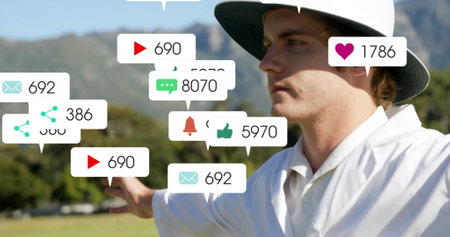 Image of icons and data processing over caucasian male cricket umpire. Global sports, social media, connections, computing and data processing concept digitally generated image.の写真素材