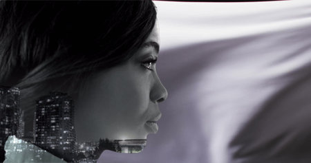 Image of biracial woman over floating cloth and cityscape. Thoughts, abstraction and lifestyle, digitally generated image.の写真素材