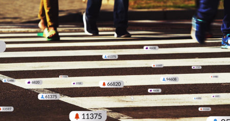Social media notifications image over pedestrian crossing. Technology, urban, digital, communication, smartphone, cityの写真素材