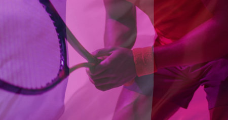 Image of flag of france over african american male tennis player. Sports, competition and active lifestyle concept digitally generated image.の写真素材