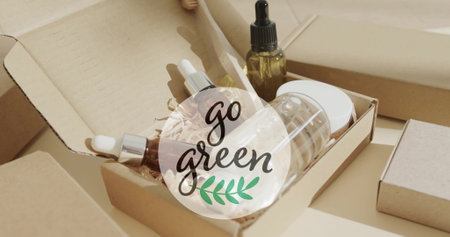 Image of go green text and leaf logo over organic beauty products in plain packaging. Wellbeing, beauty and ecology, organic, self care and natural products campaign, digitally generated image.の写真素材