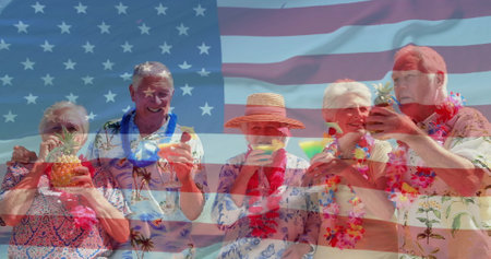 Image of flag of usa over caucasian senior friends on beach in summer. Usa, american patriotism, national flag and lifestyle concept digitally generated image.の写真素材