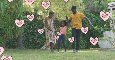 Image of hearts over happy african american family in garden. family life, love and nature concept digitally generated image.の写真素材
