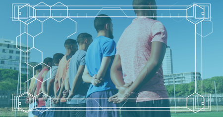 Group of biracial male athletes standing together, wearing sportswear. They have short hair, and one is wearing blue shirtの写真素材