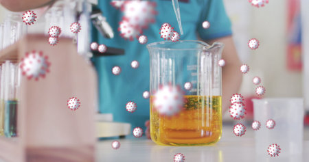 A science experiment in progress at school. A student conducts a lab test, demonstrating the spread...