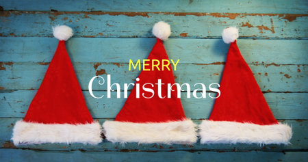 Digital composite of Merry Christmas text and Santa hatsの写真素材