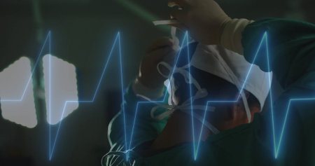 Image of data processing over diverse surgeons in hospital. Global medicine, healthcare, connections, computing and data processing concept digitally generated image.の写真素材
