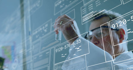 Image of data processing over caucasian male scientist working in lab. Global science, computing and digital interface concept digitally generated image.の写真素材