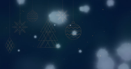 Image of light spots over christmas decorations on blue background. christmas tradition and celebration concept digitally generated image.の写真素材