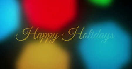 Image of happy holidays text over multicolored lens flares against black background. Digitally generated, hologram, illustration, winter, festival, christmas, event, occasion and celebration.の写真素材