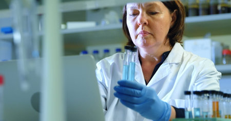 Attentive female scientist experimenting in laboratory 4k