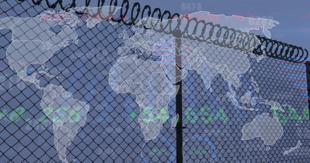 Image of financial data processing over fence and world map on blue background. Global finance, business, connections, computing and data processing concept digitally generated image.の写真素材