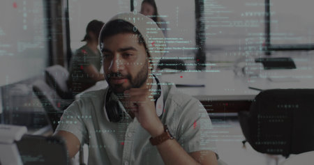 Image of data processing over biracial businessman in office. Global finance, business, connections, computing and data processing concept digitally generated image.の写真素材