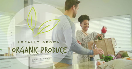 Image of organic produce text over diverse couple preparing healthy meal in kitchen. Organic food, healthy eating and cooking concept digitally generated image.の写真素材