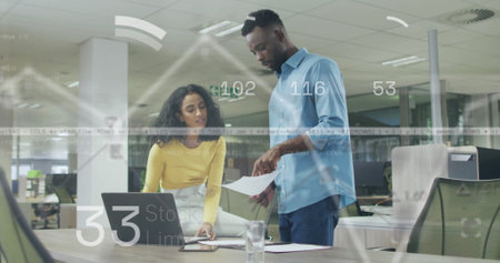 Image of financial data processing over diverse business people in office. Global finance, business, connections, computing and data processing concept digitally generated image.の写真素材