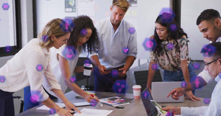 Business team collaborating over digital blockchain image with purple hexagons. Teamwork, collaboration, technology, innovation, network, futuristicの写真素材