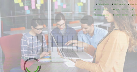 Image of financial data processing over diverse colleagues discussing work in office. Global business, finances, computing and digital interface concept digitally generated image.の写真素材