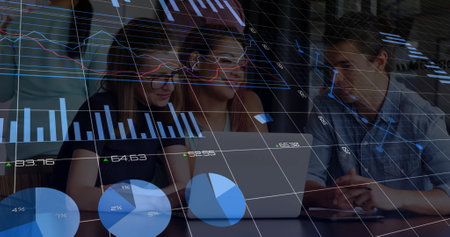 Image of financial data processing over diverse colleagues discussing work in office. Global business, finances, computing and digital interface concept digitally generated image.の写真素材