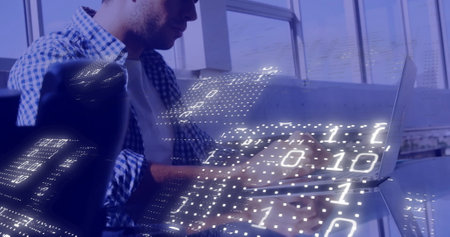 Image of binary coding data processing over caucasian businessman using laptop in office. Global...