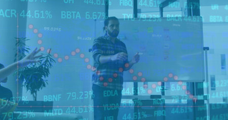 Image of financial data processing over biracial businessman in office. Global finance, business, connections, computing and data processing concept digitally generated image.の写真素材