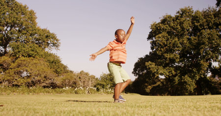 Little boy doing acrobatics in a parkの写真素材