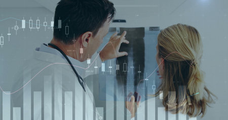 Image of financial data processing over diverse male and female doctors. Global medicine, healthcare, computing and digital interface concept digitally generated image.の写真素材