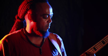 Guitarist playing electric guitar at nightclub