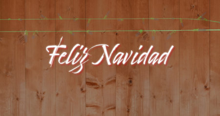 Image of Feliz Navidad over fairy lights on wooden background. Christmas, tradition and celebration concept digitally generated image.の写真素材