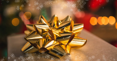 Image of christmas present and snow falling background. Christmas, tradition and celebration concept...