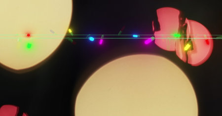 Abstract colorful lens flare over a dark background. The image captures the artistic effect of light diffraction, often used in creative photography and design.の写真素材