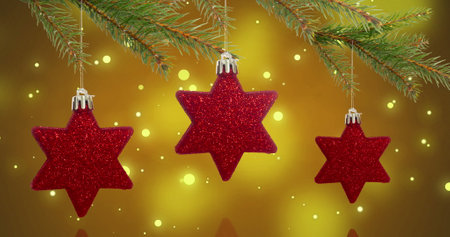 Image of red star baubles over snow falling background. Christmas, tradition and celebration concept...