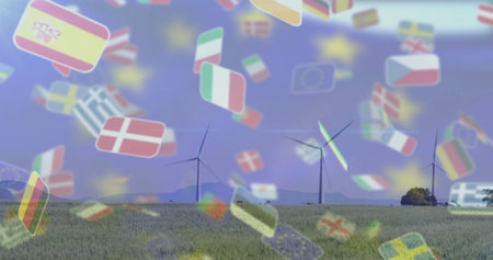 Wind turbines in field with European flags image over blue sky background. Renewable, energy, wind...