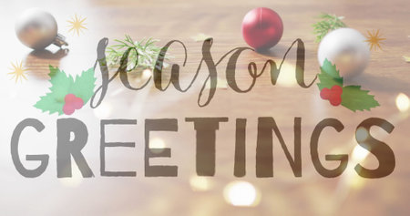 Season greetings text image over Christmas decorations on wooden background. holiday, festive, celebration, winter, seasonal, message