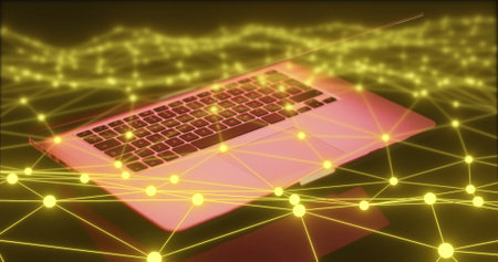 Image of glowing yellow connections over laptop keyboard, digital communication concept. technology, internet, connectivity, cyber, data, abstractの写真素材