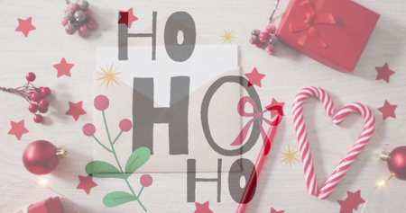 HO text image over Christmas decorations with candy canes and gifts. festive, holiday, celebration, merry, winter, presentsの写真素材
