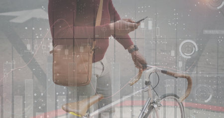 Image of diagrams and data processing over african american man using smartphone in city. Business,...