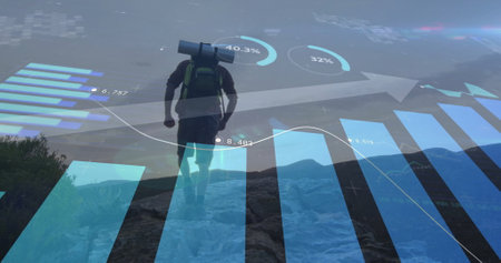 Image of financial data processing over caucasian man hiking in mountains. Global travel, finances, computing and digital interface concept digitally generated image.の写真素材